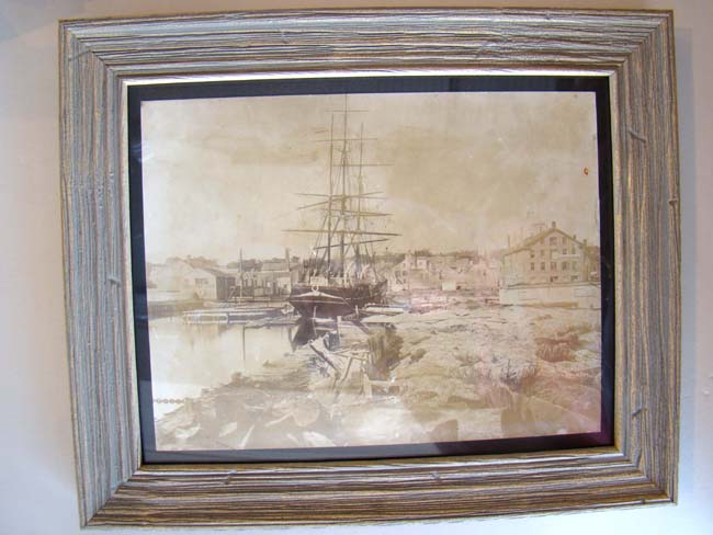 A rare original mid 19th century photograph of a whale ship tied up at a wharf in New Bedford, Mass.